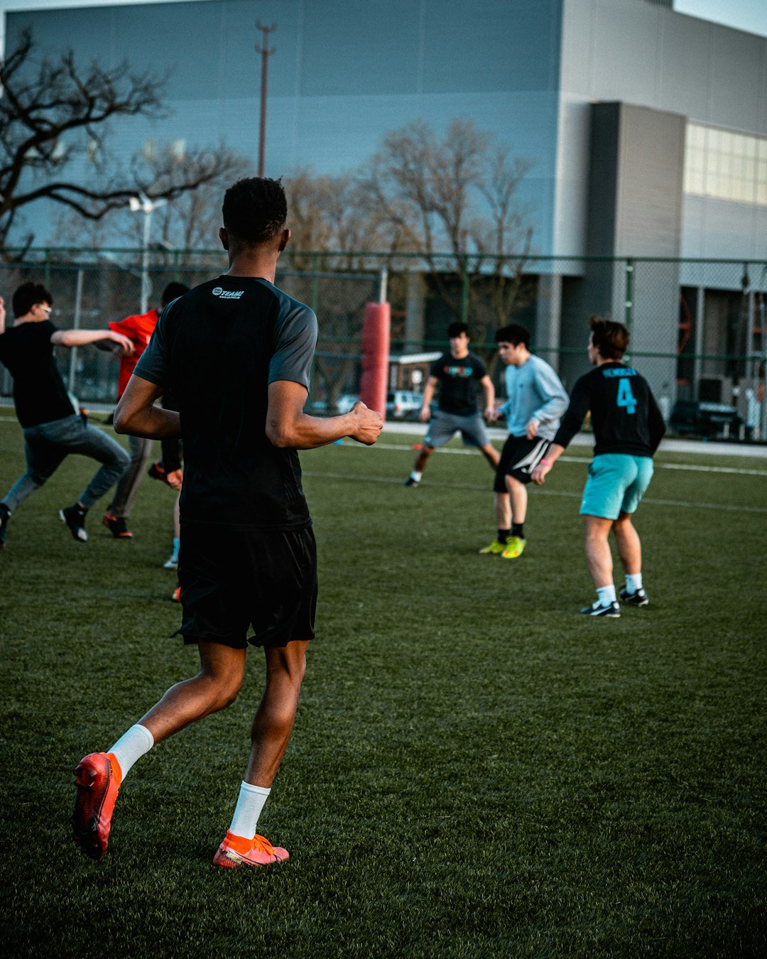 a-group-of-young-men-playing-a-game-of-frisbee-uczibcovs0s